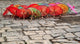Umbrellas for Sale on the Streets of Jinan Poster Print by Bruce Behnke