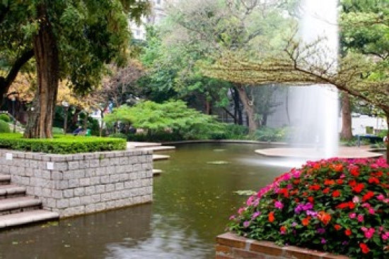 Pond With Fountain in Kowloon Park Poster Print by Charles Crust