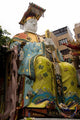 Seated Figure at the Goddess of Mercy Temple Poster Print by Cindy Miller Hopkins