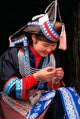 Tip-Top Miao Girl Doing Traditional Embroidery Poster Print by Keren Su
