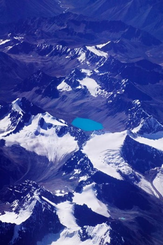Aerial view of snow-capped peaks on the Tibetan Plateau in Tibet, China, by Keren Su.