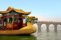 The Summer Palace Dragon Boat passing Seventeen Arch Bridge in Beijing, China poster print