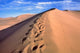 Desert Winds Footprints Poster Print by Ric Ergenbright featuring tranquil Dunhuang Desert landscape.