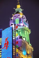 Lit Building and Neon Sign Along Nanjing Dong Lu Pedestrian Street Poster Print by Walter Bibikow