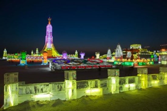 Haerbin Ice and Snow World Festival Poster Print by Walter Bibikow showing stunning ice sculptures.