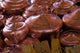 Copper kettles displayed at Lijiang Market in Yunnan Province, China.