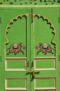 Elephants painted on a green door at City Palace, Udaipur poster print.