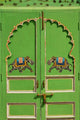 Elephants painted on a green door at City Palace, Udaipur poster print.
