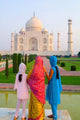 Hindu Women with Veils at the Taj Mahal Poster Print by Bill Bachmann