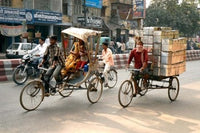 Rickshaw Movement in Varanasi, India poster print by David Noyes