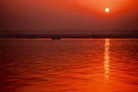 Sunset over the Ganges River in Varanasi, India Poster Print by Dee Ann Pederson