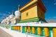 Chortens and prayer flags at Dalai Lama's home in Ladakh, India poster print.