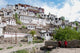 Monks standing in front of the Thiksey Monastery, Leh, Ladakh, India Poster Print by Ellen Clark