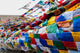 Namshangla Pass Prayer Flags Poster Print by Ellen Clark, vibrant colors and serene landscape.