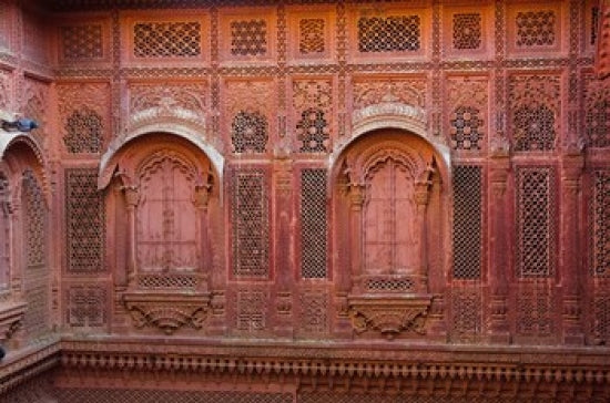 Intricately carved walls of Mehrangarh Fort poster print showcasing detailed architecture.