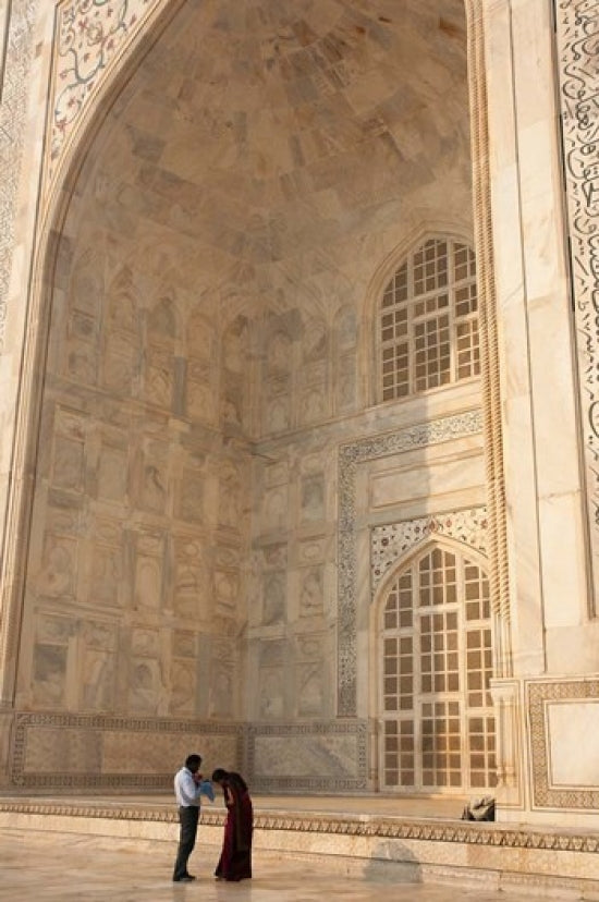 Visitors dwarfed by the majestic Taj Mahal poster print by Inger Hogstrom