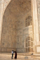 Visitors dwarfed by the Taj Mahal poster print by Inger Hogstrom