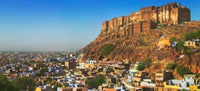 Cityscape of the Blue City with Meherangarh Fort Poster Print by Keren Su, vibrant blue architecture.