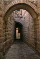 Arch of Jerusalem Stone and Narrow Lane Poster Print by Jerry Ginsberg