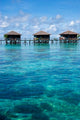 Bungalows at Sipadan-Kapalai Dive Resort Poster Print by Ali Kabas