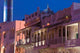 Mutrah Corniche Evening Poster Print by Walter Bibikow showcasing restored merchant buildings