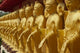 Standing gold-colored Buddha statues at Foukuangshan Temple poster print.