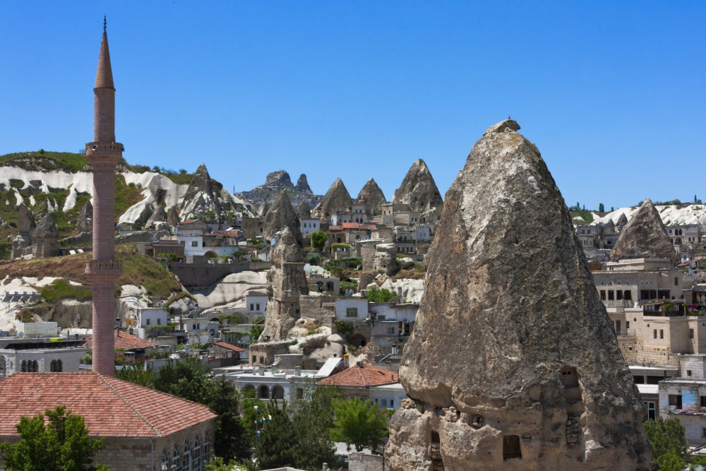 Houses and churches carved into rock formation in Goreme, Cappadocia, Turkey Poster Print by Keren Su.