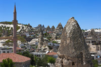Houses and churches carved into rock formation in Goreme, Cappadocia, Turkey Poster Print by Keren Su.