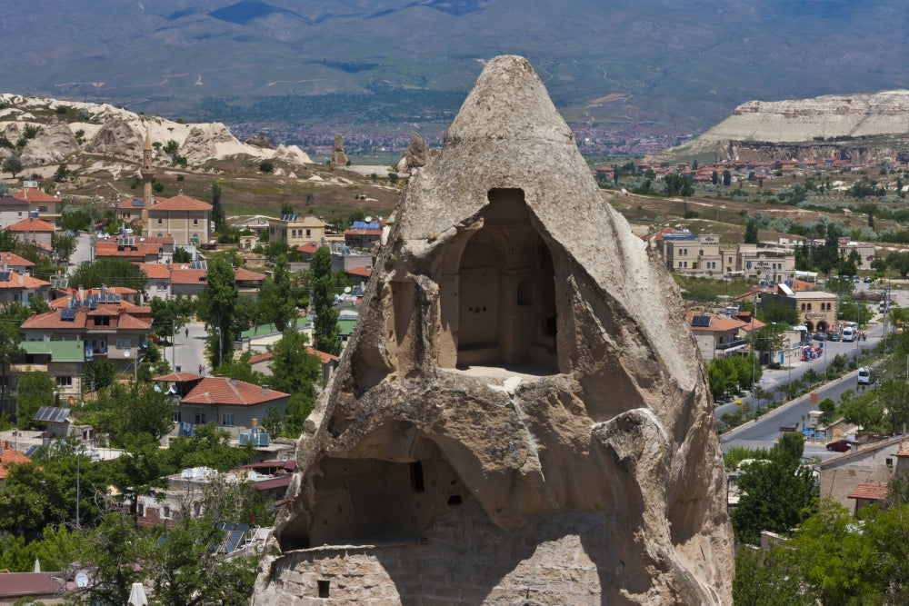 Houses carved into rock formation in Goreme, Cappadocia, Turkey poster print by Keren Su.