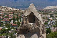 Houses carved into rock formation in Goreme, Cappadocia, Turkey poster print by Keren Su.