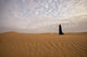 Bedouin woman in the desert poster print by Tom Norring, showcasing the beauty of Abu Dhabi.