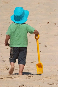 Little Boy with Spade on Beach Poster Print by David Wall
