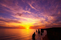 Sunset at Twelve Apostles Poster Print by David Wall, showcasing the stunning coastal landscape of Port Campbell National Park.