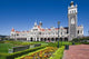 Poster print of Park Near Ornate Railroad Station in Dunedin, South Island, New Zealand.