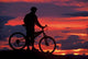 Mountain Biker at Sunset in Dunstan Mountains Poster Print by David Wall