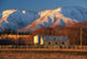 Woolshed and Kakanui Mountains poster print by David Wall showcasing the stunning landscapes of Otago, New Zealand.
