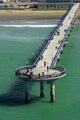 New Brighton Pier Poster Print by David Wall showcasing the serene beauty of Christchurch, New Zealand.