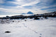 Footsteps in Snow and Mt Ngauruhoe Poster Print by David Wall, depicting Tongariro National Park, New Zealand.