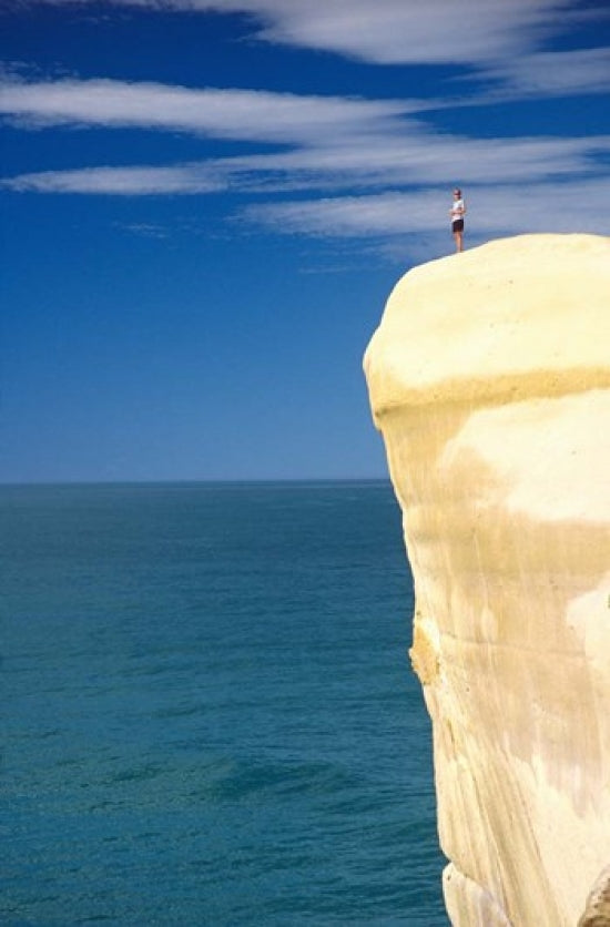 Person on Cliff Top, Tunnel Beach, Dunedin, New Zealand Poster Print by David Wall