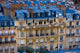 The Louvre Museum at Twilight Poster Print showcasing Parisian architecture at sunset.