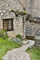 Saint-Cirq Lapopie cobblestone path poster print by Hollice Looney.