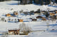 Ski Village in Winter Poster Print by Walter Bibikow showcasing ski chateaus in a snowy landscape.