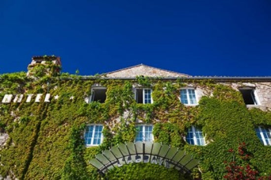 Le Abbaye Hotel Poster Print by Walter Bibikow showcasing elegant architecture.