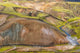 Iceland Fjallabak Nature Reserve Poster Print featuring multicolored lava hills and a small river by Ellen Goff.