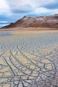 Patterns of drying mud at Hverir Geothermal Area poster print.