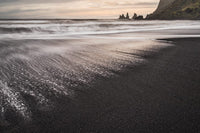 Iceland Reynisfjara Beach Poster Print showcasing stunning black sand beach and sea stacks.