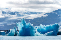 Iceland floating glaciers forming blue ice sculptures at Jokulsarlon glacier lagoon.