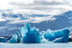 Iceland floating glaciers forming blue ice sculptures at Jokulsarlon glacier lagoon.