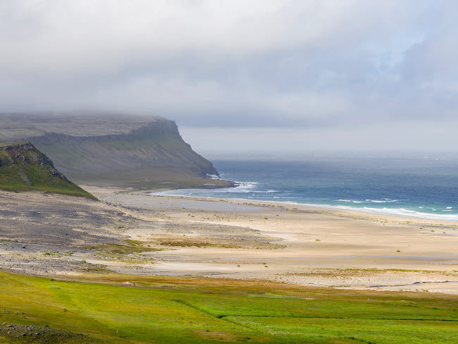 The Sandy Beach at Breidavik poster print by Martin Zwick showcasing the tranquil Icelandic coastline.