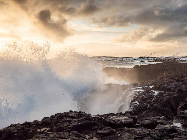 Coastline at Brimketill during winter storm conditions at sunset poster print by Martin Zwick.